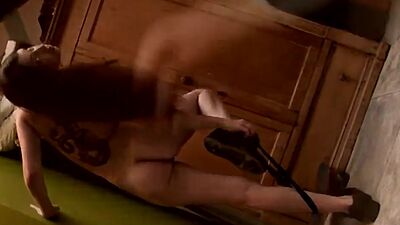 Lesbian nina stripping off beside the green wall