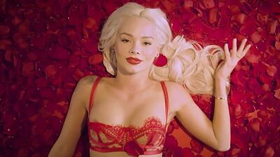 Petite all natural blondie Elsa Jean taking off her fancy red lingerie