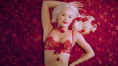 Petite all natural blondie Elsa Jean taking off her fancy red lingerie