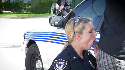 Busty police officers IR banged in the middle of the street