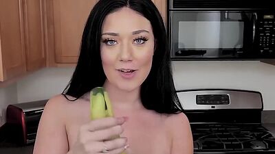 Voluptuous glam girl is naked and toys pussy with a cucumber