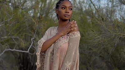 Huge boobs ebony MILF model Nyla solo striptease outdoor for Playboy