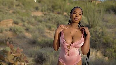 Huge boobs ebony MILF model Nyla solo striptease outdoor for Playboy