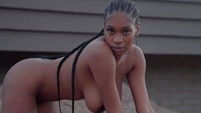 Huge boobs ebony MILF model Nyla solo striptease outdoor for Playboy