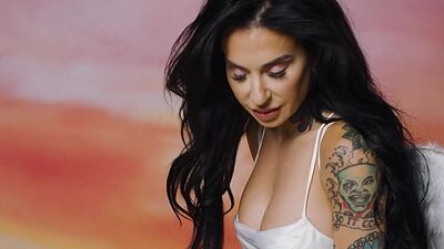 Busty MILF Joanna Angel shows her luscious body with tattoos for Playboy