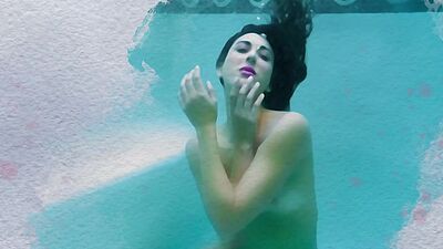 Petite latina MILF Brett Barletta dips her luscious body naked in a pool