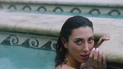 Petite latina MILF Brett Barletta dips her luscious body naked in a pool