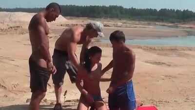 Teen brunette fucked on the beach in all holes