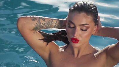 Glamorous all natural Emjay Rinaudo stripped and posed by the pool outdoor