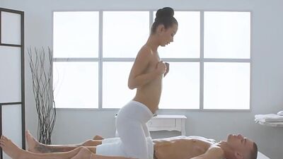 Oiled masseuse enjoys passionate sex on massage table
