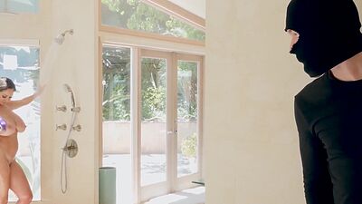 Irresistible mature babe squeezes intruders big dick