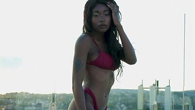 Ebony beauty from Cameroon Mimi Desuka gets naked in a pool for Playboy