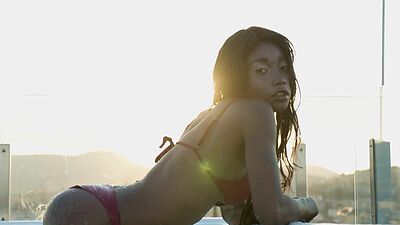 Ebony beauty from Cameroon Mimi Desuka gets naked in a pool for Playboy