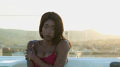 Ebony beauty from Cameroon Mimi Desuka gets naked in a pool for Playboy