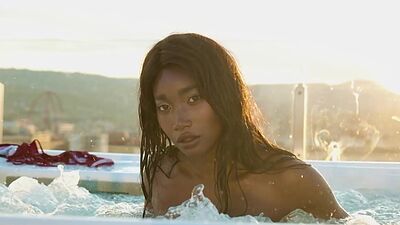 Ebony beauty from Cameroon Mimi Desuka gets naked in a pool for Playboy