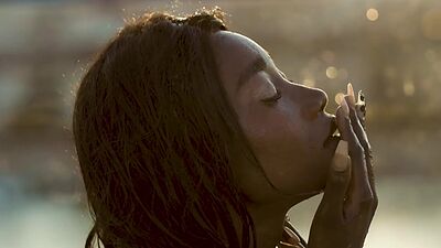 Ebony beauty from Cameroon Mimi Desuka gets naked in a pool for Playboy