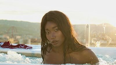 Ebony mermaid Mimi Desuka reveals her big natural boobs in the jacuzzi