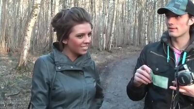 Busty girl gives public blowjob