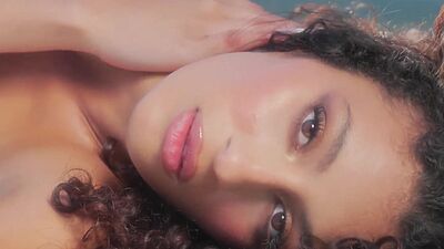 Curly Latina teen model shows stunning body and posed naked and painted