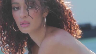 Curly Latina teen model shows stunning body and posed naked and painted