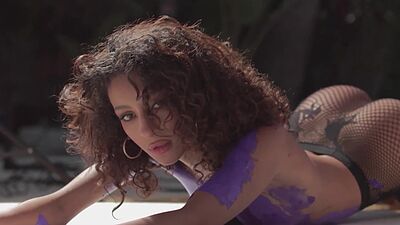 Curly Latina teen model shows stunning body and posed naked and painted