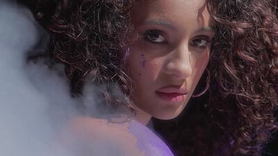 Curly Latina teen model shows stunning body and posed naked and painted