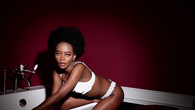 Skinny naked ebony babe Alicia reveals her black pussy in the bathtube