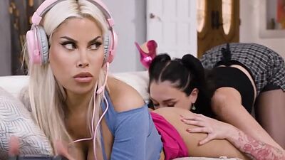 Charlotte Sins got aroused by Melody Sparks while paying a game.