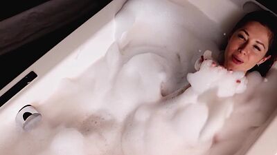 Hot babe with perfect ass Diana Lark passionately posed in bubble bathtub