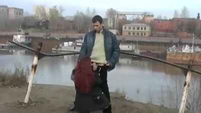 Redhead student sucks on the banks of the river for all to see