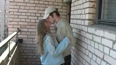 Young blonde sucking on the veranda