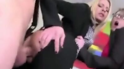 Clothed female bosses demand their employees to fuck their asses