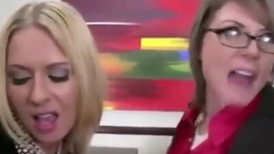 Clothed female bosses demand their employees to fuck their asses