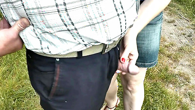 Random man pees. My wife bitch was passing by and held his penis in fingers. Public. Outdoor. Outside. MILF. Skirt