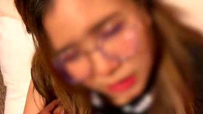 A babe wearing glasses in a Japanese school uniform gets fucked in the arse. She has a plump body, a tight pussy, and is very horny.