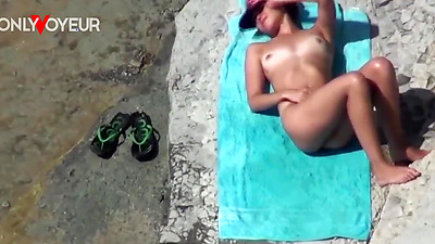 Beach Voyeur. Super horny teen getting off right on the nude beach