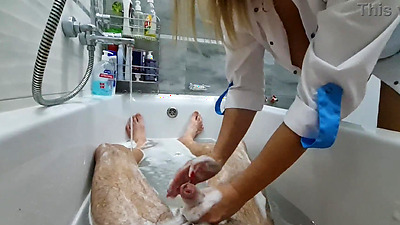 Stepmom cme in to wash her naked stepson, she ignores his big shaft, he is very excited and wants to jerk off, she flashes her big tits and starts masturbating