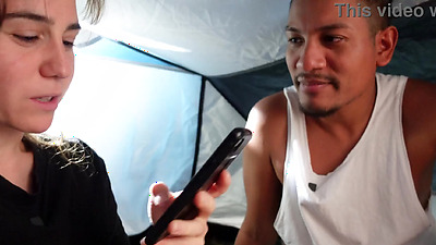 A travel vlogger has her guide sneak into her tent