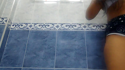 Cute woman pissing in public bathroom