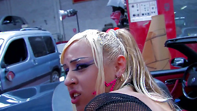 Cute girl with long blonde hair and piercings takes care of a boner