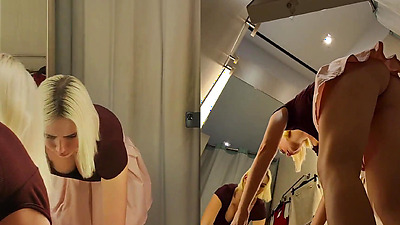 Hidden camera spying on a blonde with a big booty NO PANTY in a public store. Blonde flash big tits