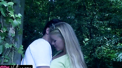 The busty blonde gets naughty in the forest