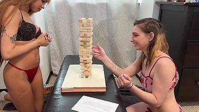 Enjoying a sex toy from her skinny lesbian friend