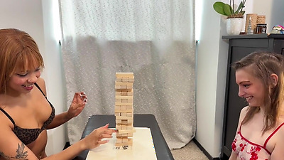 Enjoying a sex toy from her skinny lesbian friend