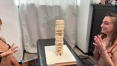 Enjoying a sex toy from her skinny lesbian friend