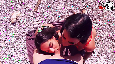 German tourist tows 2 latinas on the beach on vacation