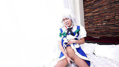 Sexy Asian slutty chick Anna Saotome fucks with sex toy on the bed in costume.