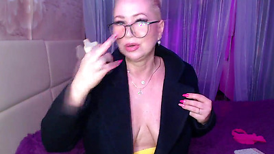 A cool busty vulgar mature bitch in glasses with a ponytail on her head...