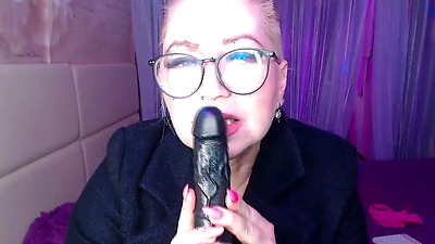 A cool busty vulgar mature bitch in glasses with a ponytail on her head...