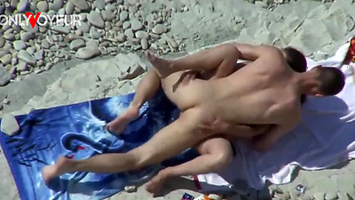 Beach Voyeur. Busty cougar riding hard cock and getting load of cum on her face
